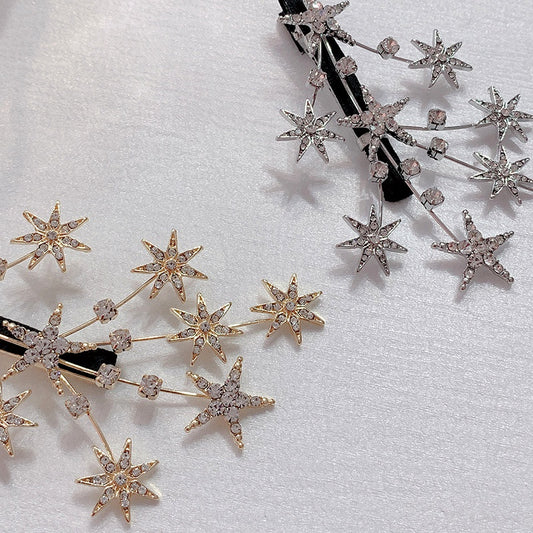 Hårspenne i gull og sølvfarge