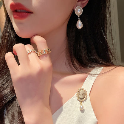 Ørepynt med detaljer av perler