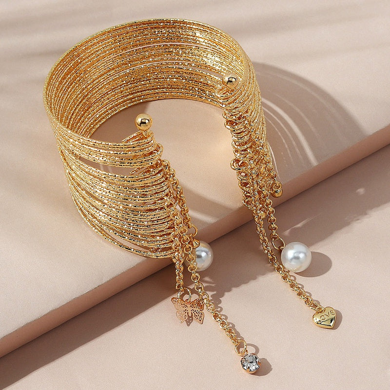 Gullfarget armbånd med perler